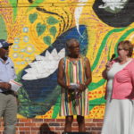Red Springs Arts Council Member Maggy Klingner Morley speaking about the mural in Red Springs, NC dedicated to missing and murdered Indigenous women.